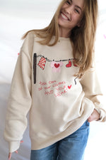 “Take Care” Clothesline Sweatshirt