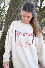 “Take Care” Clothesline Sweatshirt