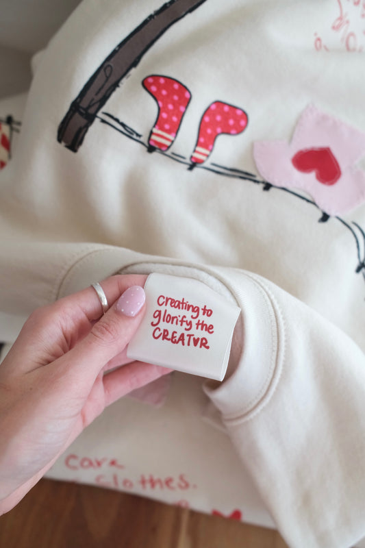 “Take Care” Clothesline Sweatshirt