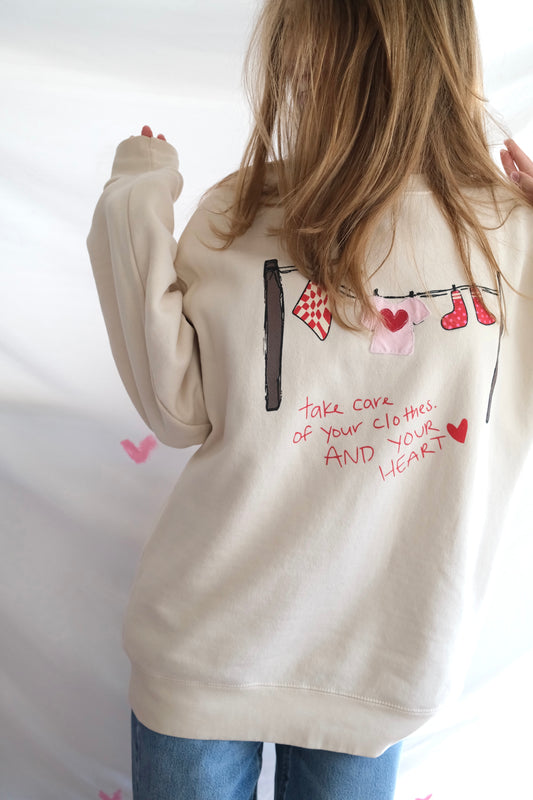 “Take Care” Clothesline Sweatshirt